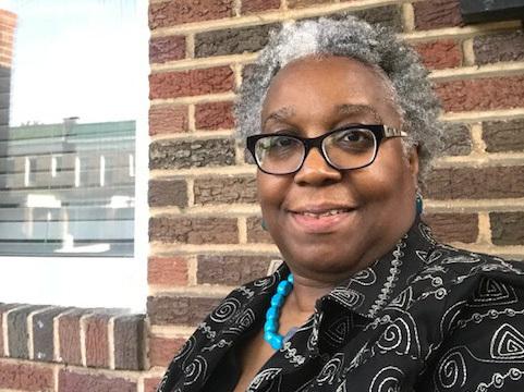 Wanda Onafuwa says a house next door to her in Baltimore fell into disrepair after Bank of America foreclosed on the property. Wanda Onafuwa says a house next door to her in Baltimore fell into disrepair after Bank of America foreclosed on the property.