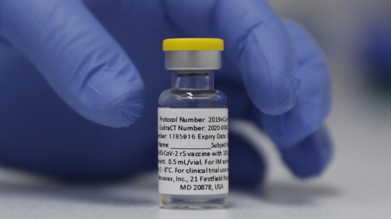 A vial of the experimental Novavax coronavirus vaccine is ready for use in a London study in 2020. Novavax's vaccine candidate contains a noninfectious bit of the virus — the spike protein — with a substance called an adjuvant added that helps the bod A vial of the experimental Novavax coronavirus vaccine is ready for use in a London study in 2020. Novavax's vaccine candidate contains a noninfectious bit of the virus — the spike protein — with a substance called an adjuvant added that helps the bod