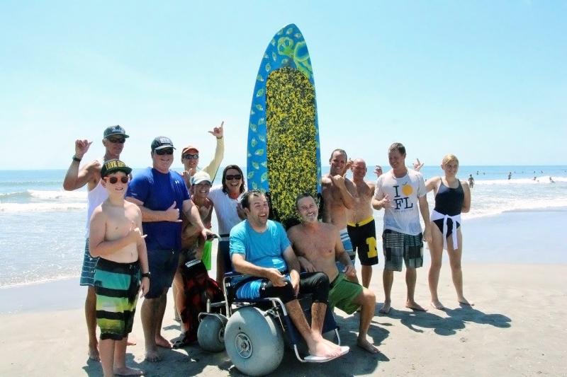 It took a team of delighted friends and family to help Florida engineer Matt Bellina (center) get back on his surfboard this summer after his severe spinal injury. The result? "I feel like I'm home," Bellina said. It took a team of delighted friends and family to help Florida engineer Matt Bellina (center) get back on his surfboard this summer after his severe spinal injury. The result? "I feel like I'm home," Bellina said.