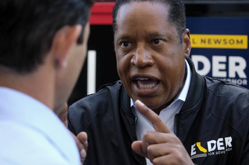 Republican conservative radio show host Larry Elder argues with a TV reporter in an interview Monday after visiting Philippe the Original deli during the campaign for the California gubernatorial recall election in Los Angeles. Republican conservative radio show host Larry Elder argues with a TV reporter in an interview Monday after visiting Philippe the Original deli during the campaign for the California gubernatorial recall election in Los Angeles.