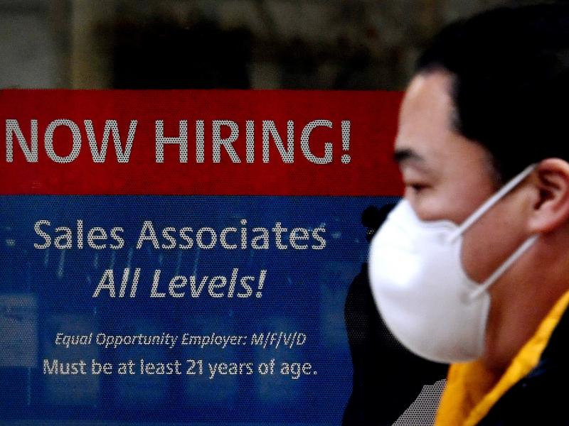 A man walks past a "Now Hiring" sign in front of a store in early December in Arlington, Va. U.S. employers added 379,000 jobs in February, as hiring picked up sharply from the previous month. A man walks past a "Now Hiring" sign in front of a store in early December in Arlington, Va. U.S. employers added 379,000 jobs in February, as hiring picked up sharply from the previous month.