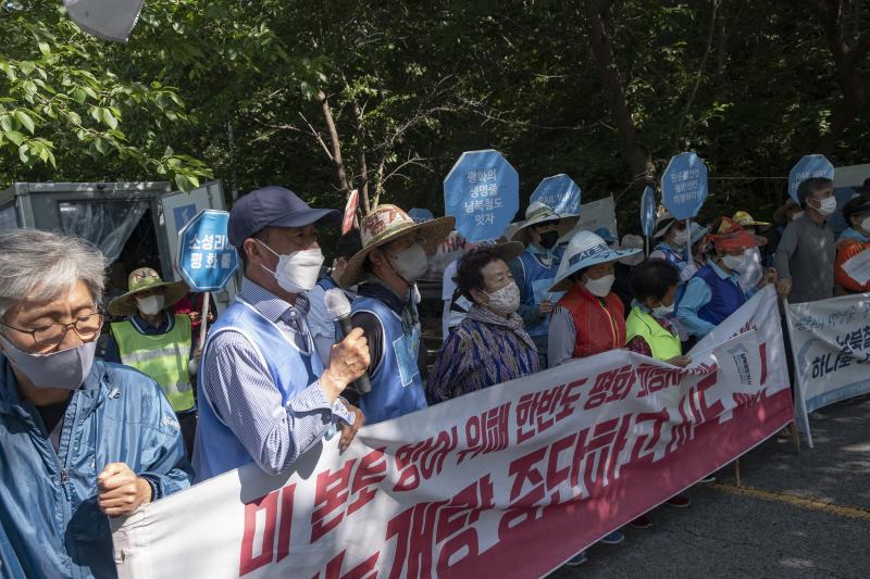 Activists demonstrate against a U.S. missile defense system installed in Seongju county, South Korea, since 2017. Protesters stand near the entrance of the base, the site of a former golf course. Activists demonstrate against a U.S. missile defense system installed in Seongju county, South Korea, since 2017. Protesters stand near the entrance of the base, the site of a former golf course.