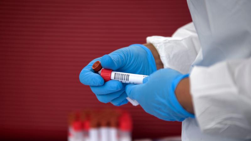 A health care worker organizes coronavirus tests that were administered at a United Memorial Medical Center testing site in Houston on June 25. A health care worker organizes coronavirus tests that were administered at a United Memorial Medical Center testing site in Houston on June 25.