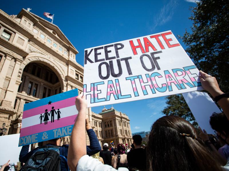 Demonstrators hold signs in support of transgender youth and rights in response to recent proposed legal action against parents seeking gender affirming healthcare for their children to be charged as child abuse at the Rally for Trans Youth at the Texas S Demonstrators hold signs in support of transgender youth and rights in response to recent proposed legal action against parents seeking gender affirming healthcare for their children to be charged as child abuse at the Rally for Trans Youth at the Texas S