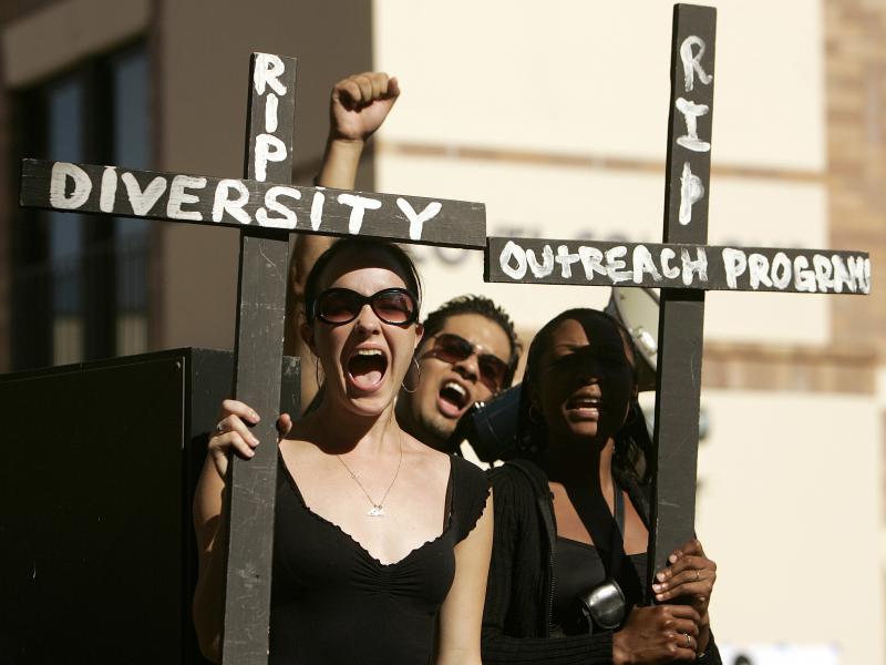 UCLA students hold crosses, while taking part in a 2006 rally on campus to express their concerns about the lack of racial diversity in the student body. UCLA students hold crosses, while taking part in a 2006 rally on campus to express their concerns about the lack of racial diversity in the student body.