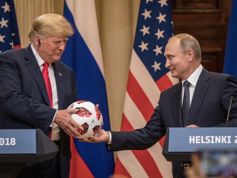 Russian President Vladimir Putin hands President Trump a World Cup soccer ball during a joint news conference after their July 2018 summit in Helsinki. Russian President Vladimir Putin hands President Trump a World Cup soccer ball during a joint news conference after their July 2018 summit in Helsinki.