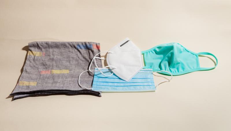 Left to right: a neck gaiter (aka a buff) that slips over the head; a KN95 respirator, a version of the N95 respirator used in U.S. hospitals; a pleated surgical mask (below the KN95); a cloth mask. Left to right: a neck gaiter (aka a buff) that slips over the head; a KN95 respirator, a version of the N95 respirator used in U.S. hospitals; a pleated surgical mask (below the KN95); a cloth mask.