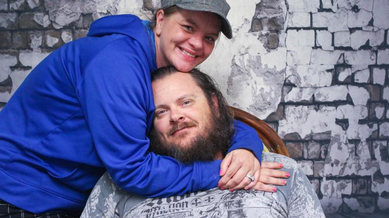 Jamie Topping embraces Duane Topping during their StoryCorps interview in May, at their Denver-based studio. Jamie Topping embraces Duane Topping during their StoryCorps interview in May, at their Denver-based studio.