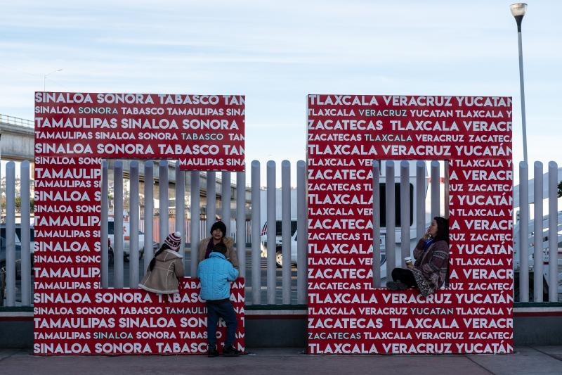 Migrants seeking an asylum appointment with U.S. Customs and Border Protection officers wait at El Chaparral port of entry in Tijuana. Migrants seeking an asylum appointment with U.S. Customs and Border Protection officers wait at El Chaparral port of entry in Tijuana.