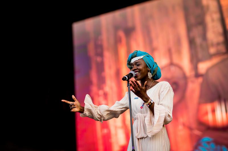 Slam poet and UNHCR Goodwill Ambassador Emi Mahmoud performs at the Sziget Festival in Hungary in 2019. Slam poet and UNHCR Goodwill Ambassador Emi Mahmoud performs at the Sziget Festival in Hungary in 2019.