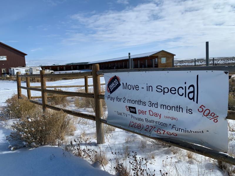 A sign in the Jonah Field advertises cheap rates at a deserted motel built for oil and gas workers. A sign in the Jonah Field advertises cheap rates at a deserted motel built for oil and gas workers.