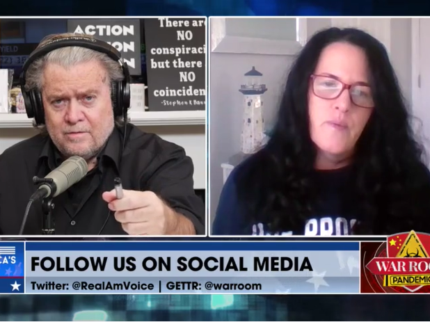 Cynthia Hughes, seen here wearing a "Due Process Denied" shirt, has become a regular on Steve Bannon's show, where she has described the Jan. 6 defendants as "political prisoners." On a recent episode, Hughes announced changes to the Patriot Freedom Proje Cynthia Hughes, seen here wearing a "Due Process Denied" shirt, has become a regular on Steve Bannon's show, where she has described the Jan. 6 defendants as "political prisoners." On a recent episode, Hughes announced changes to the Patriot Freedom Proje