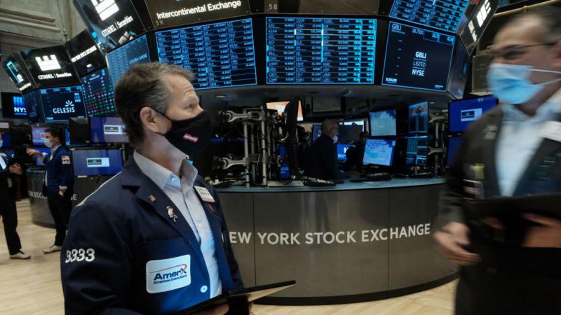 Traders work on the floor of the New York Stock Exchange. Lawmakers from both parties are stepping up calls to ban members of Congress from trading individual stocks. Traders work on the floor of the New York Stock Exchange. Lawmakers from both parties are stepping up calls to ban members of Congress from trading individual stocks.