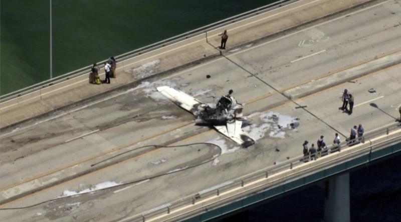 Emergency personnel respond to a small plane crash in Miami on Saturday. Emergency personnel respond to a small plane crash in Miami on Saturday.