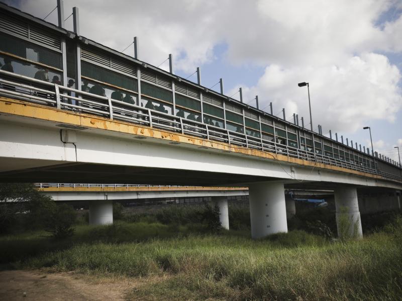 Pedestrians on the Puerta Mexico bridge, which crosses the Rio Grande, wait to enter Brownsville, Texas, at a legal port of entry in Matamoros, Mexico, in August. Pedestrians on the Puerta Mexico bridge, which crosses the Rio Grande, wait to enter Brownsville, Texas, at a legal port of entry in Matamoros, Mexico, in August.