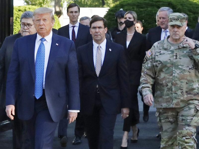 President Trump and his advisers, including Attorney General William Barr, walk through Lafayette Square on June 1 after it was cleared of protesters. Trump then posed for photos holding up a Bible in front of St. John's Episcopal Church. President Trump and his advisers, including Attorney General William Barr, walk through Lafayette Square on June 1 after it was cleared of protesters. Trump then posed for photos holding up a Bible in front of St. John's Episcopal Church.