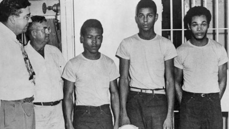(From left) Lake County, Fla., Sheriff Willis McCall and an unidentified man stand next to Walter Irvin, Samuel Shepherd and Charles Greenlee. The three were accused of rape in 1949, along with a fourth man. They were all pardoned Friday. (From left) Lake County, Fla., Sheriff Willis McCall and an unidentified man stand next to Walter Irvin, Samuel Shepherd and Charles Greenlee. The three were accused of rape in 1949, along with a fourth man. They were all pardoned Friday.