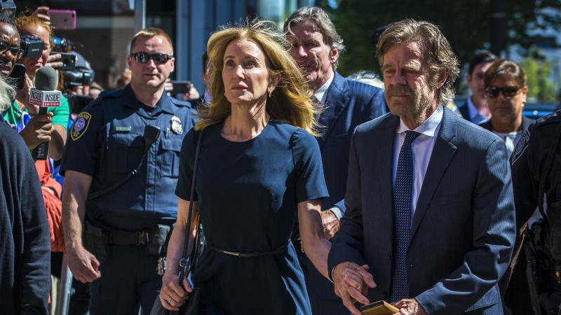Actress Felicity Huffman and her husband, actor William H. Macy, arrive for her sentencing hearing Friday at the John Joseph Moakley United States Courthouse in Boston. Actress Felicity Huffman and her husband, actor William H. Macy, arrive for her sentencing hearing Friday at the John Joseph Moakley United States Courthouse in Boston.