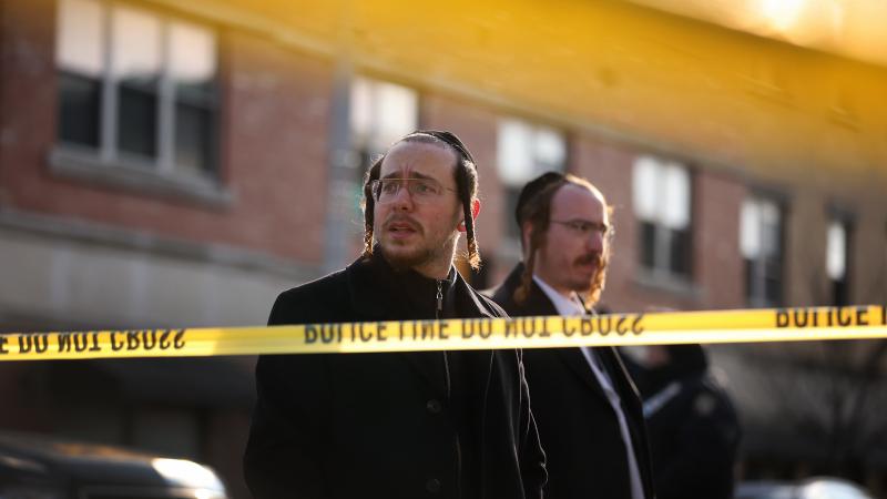 Members of the local Jewish community gather Wednesday outside the JC Kosher Supermarket in Jersey City, the site of what is now being called a potential act of terrorism. Members of the local Jewish community gather Wednesday outside the JC Kosher Supermarket in Jersey City, the site of what is now being called a potential act of terrorism.