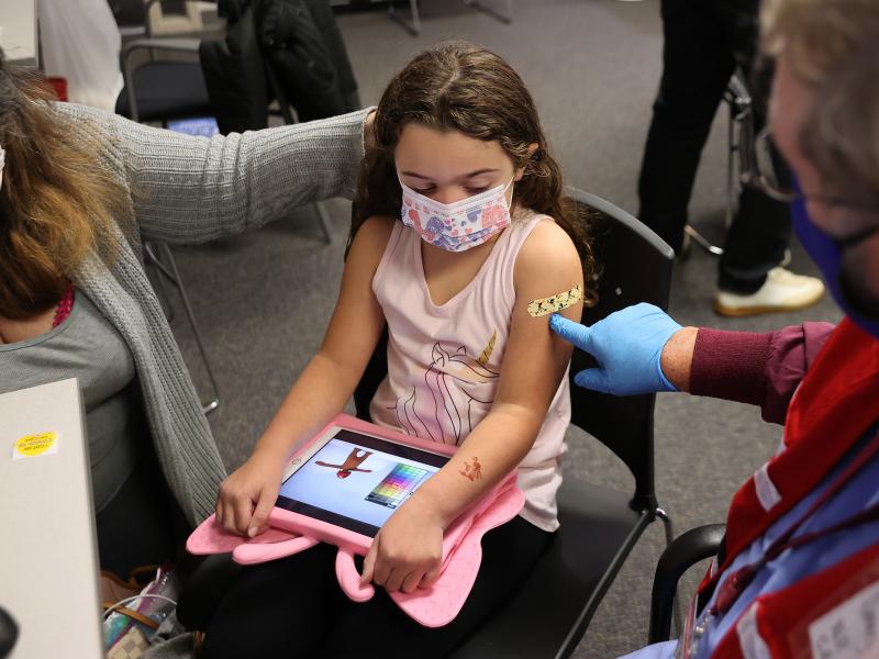 A child receives the Pfizer BioNTech COVID-19 vaccine at the Fairfax County Government Center in Annandale, Va., in November 2021. A committee of advisers to the Food and Drug Administration recommended Wednesday that the agency expand authorization of C A child receives the Pfizer BioNTech COVID-19 vaccine at the Fairfax County Government Center in Annandale, Va., in November 2021. A committee of advisers to the Food and Drug Administration recommended Wednesday that the agency expand authorization of C
