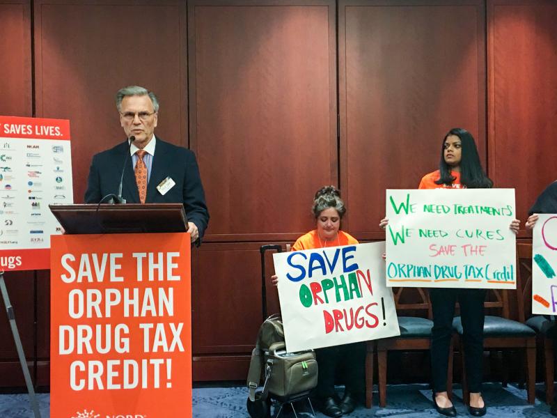 Peter Saltonstall, president of the National Organization of Rare Disorders, speaks at a rally Tuesday in support of tax credits for companies that develop drugs for rare diseases. Peter Saltonstall, president of the National Organization of Rare Disorders, speaks at a rally Tuesday in support of tax credits for companies that develop drugs for rare diseases.