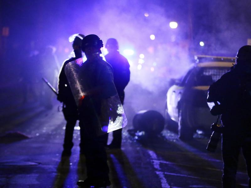 Police officers in Ferguson, Mo., during a protest in 2014. Advocates want the Justice Department to step up its oversight of law enforcement in the incoming administration. Police officers in Ferguson, Mo., during a protest in 2014. Advocates want the Justice Department to step up its oversight of law enforcement in the incoming administration.