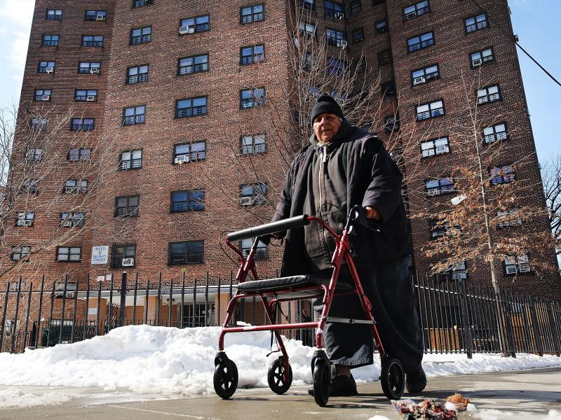 A man walks by the Farragut Houses, a public housing project in Brooklyn, N.Y. The budget blueprint President Trump released Thursday calls for the cutting of billions of dollars in funding from the Department of Housing and Urban Development. A man walks by the Farragut Houses, a public housing project in Brooklyn, N.Y. The budget blueprint President Trump released Thursday calls for the cutting of billions of dollars in funding from the Department of Housing and Urban Development.