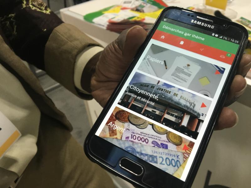 The E-Citizen app from Senegal uses photos and audio recordings. For example, click on a photo of a baby and select either French or a local dialect. You'll hear how to register a newborn child. The E-Citizen app from Senegal uses photos and audio recordings. For example, click on a photo of a baby and select either French or a local dialect. You'll hear how to register a newborn child.