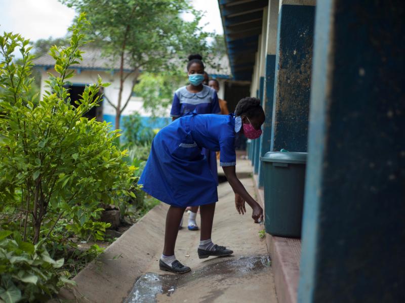 A student washes her hands before entering a classroom at a school in Blantyre, Malawi, in March 2021. Top scientists say that many African countries, including Malawi, appear to have already arrived at a substantially less threatening stage of the corona A student washes her hands before entering a classroom at a school in Blantyre, Malawi, in March 2021. Top scientists say that many African countries, including Malawi, appear to have already arrived at a substantially less threatening stage of the corona