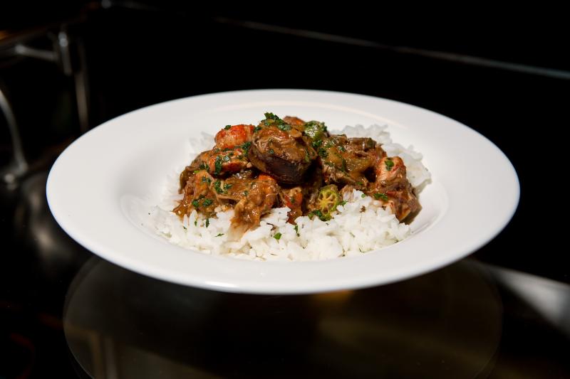 Duck, Andouille and Crawfish Gumbo, with Carolina rice and green onion, which is served in the Creole Coast section of the cafe. Duck, Andouille and Crawfish Gumbo, with Carolina rice and green onion, which is served in the Creole Coast section of the cafe.