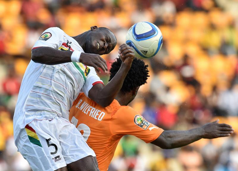 Guinea's defender Fode Camara (left) heads the ball over Ivory Coast's forward Wilfried Bony in the Africa Cup of Nations tournament. Guinea's defender Fode Camara (left) heads the ball over Ivory Coast's forward Wilfried Bony in the Africa Cup of Nations tournament.