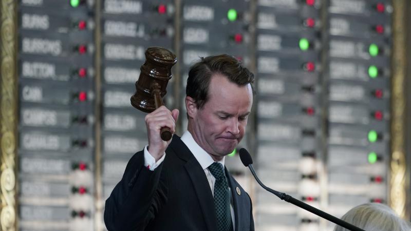Texas Republican House Speaker Dade Phelan strikes his gavel as the House votes on an amendment to election bill SB1 on Thursday. The legislation easily passed in the GOP-led chamber. Texas Republican House Speaker Dade Phelan strikes his gavel as the House votes on an amendment to election bill SB1 on Thursday. The legislation easily passed in the GOP-led chamber.