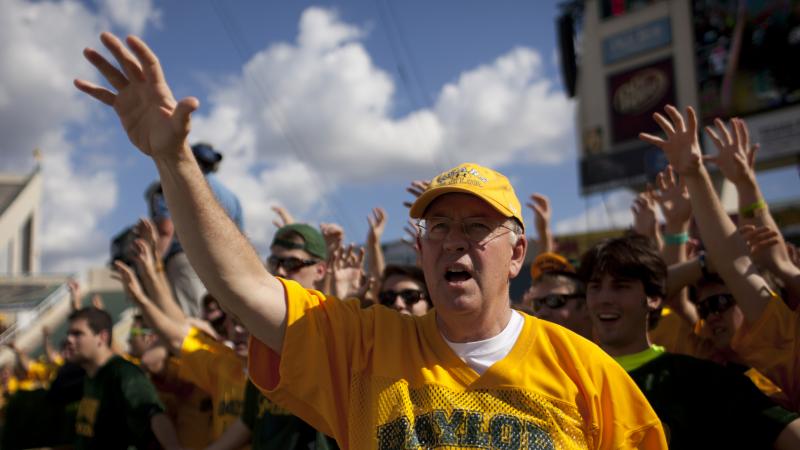 Ken Starr cheers with Baylor University students before a 2012 game against the University of Kansas Jayhawks in Waco, Texas. Ken Starr cheers with Baylor University students before a 2012 game against the University of Kansas Jayhawks in Waco, Texas.