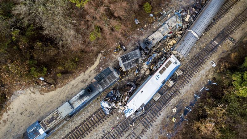 An aerial view of the site in Cayce, S.C., where an Amtrak passenger train (bottom right) slammed into a CSX freight train early Sunday morning. At least two Amtrak crew members were killed and more than 100 people injured, authorities said. An aerial view of the site in Cayce, S.C., where an Amtrak passenger train (bottom right) slammed into a CSX freight train early Sunday morning. At least two Amtrak crew members were killed and more than 100 people injured, authorities said.