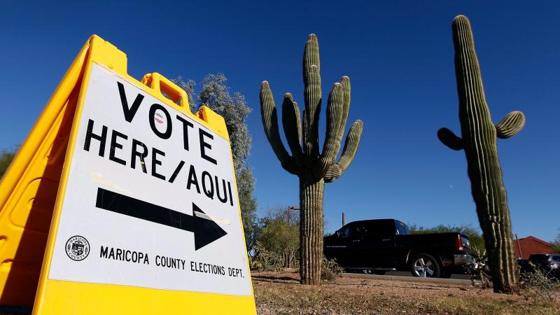 A sign directs voters to a polling station on Nov. 8, 2016, in Cave Creek, Arizona. The state is one of several considering new voting laws that could make it more complicated to vote in 2020. A sign directs voters to a polling station on Nov. 8, 2016, in Cave Creek, Arizona. The state is one of several considering new voting laws that could make it more complicated to vote in 2020.