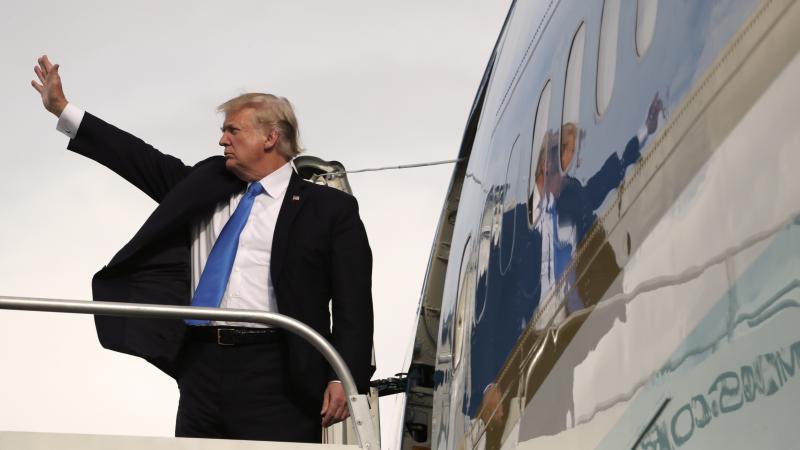 President Trump waves goodbye as he enters Air Force One after participating in the East Asia Summit on Tuesday in the Philippines capital Manila. Trump finished a five-country trip through Asia visiting Japan, South Korea, China, Vietnam and the Philippi President Trump waves goodbye as he enters Air Force One after participating in the East Asia Summit on Tuesday in the Philippines capital Manila. Trump finished a five-country trip through Asia visiting Japan, South Korea, China, Vietnam and the Philippi