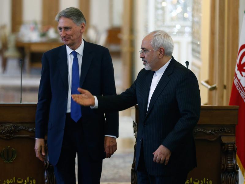 British Foreign Secretary Philip Hammond and Iranian Foreign Minister Mohammad Javad Zarif deliver a joint news conference following their meeting in Tehran, on Sunday, as the British embassy is reopened after being shuttered for nearly four years. British Foreign Secretary Philip Hammond and Iranian Foreign Minister Mohammad Javad Zarif deliver a joint news conference following their meeting in Tehran, on Sunday, as the British embassy is reopened after being shuttered for nearly four years.