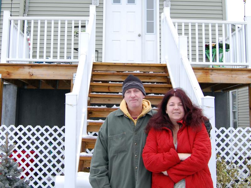 Dan and Eileen Stapleton in front of their post-Sandy home in Long Beach, N.Y. They say it would cost taxpayers less if insurance just settled their claim. Dan and Eileen Stapleton in front of their post-Sandy home in Long Beach, N.Y. They say it would cost taxpayers less if insurance just settled their claim.