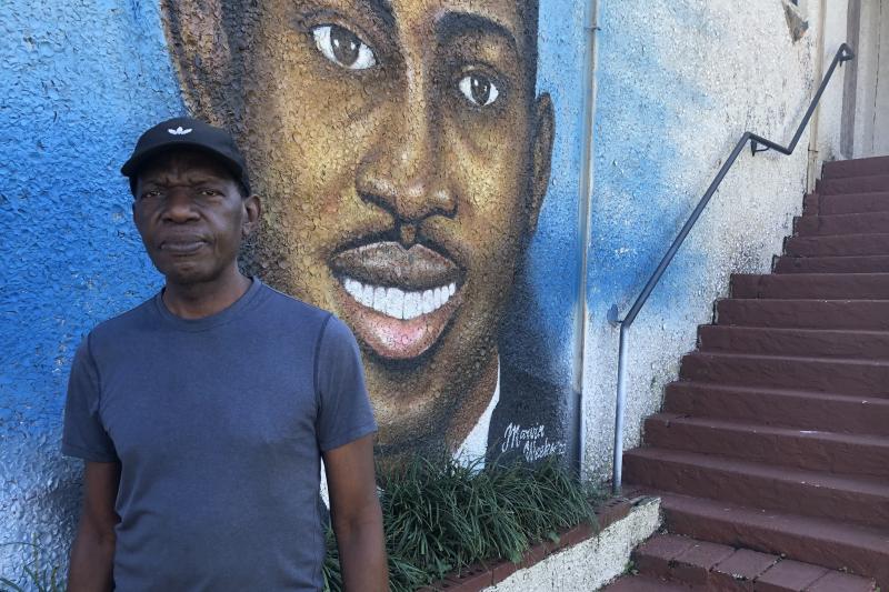 Marvin Weeks in front of his mural of Ahmaud Arbrery. Marvin Weeks in front of his mural of Ahmaud Arbrery.