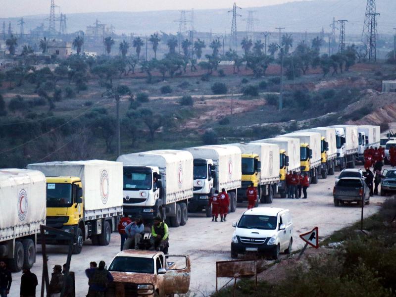 A convoy of vehicles carrying humanitarian aid sent by the United Nations moves toward the villages of Fua and Kafraya in Syria's Idlib province. A convoy of vehicles carrying humanitarian aid sent by the United Nations moves toward the villages of Fua and Kafraya in Syria's Idlib province.
