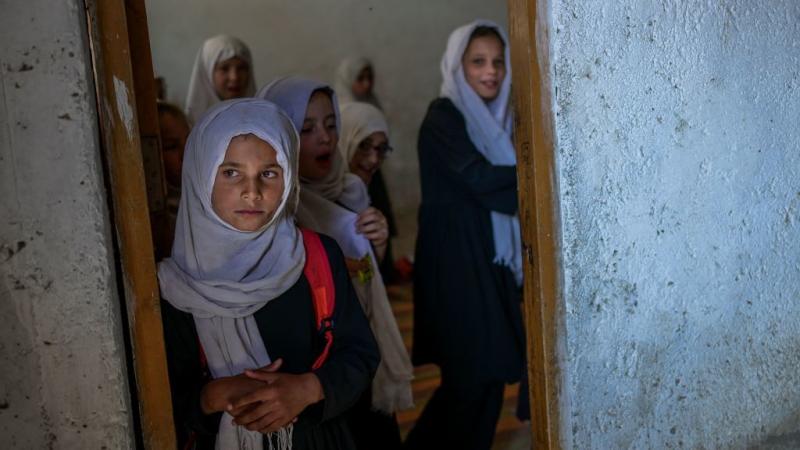 Girls gather at a gender-segregated school in Kabul on Sept. 15. When older secondary students returned to classes, female students were told to wait. Girls gather at a gender-segregated school in Kabul on Sept. 15. When older secondary students returned to classes, female students were told to wait.