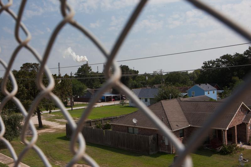 A smokestack rises in the background over the East Houston community of Manchester, Texas, where the air was heavy with what smelled like gasoline after Hurricane Harvey in late August. The neighborhood is ringed by industrial sites. A smokestack rises in the background over the East Houston community of Manchester, Texas, where the air was heavy with what smelled like gasoline after Hurricane Harvey in late August. The neighborhood is ringed by industrial sites.