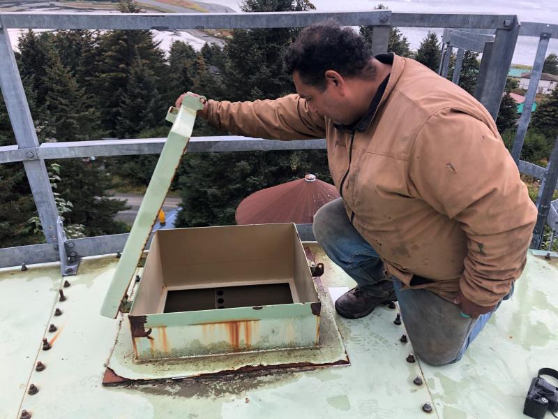 Resident Anthony Brewster checks to see how much water is in Nanwalek's storage tank. The village has been on a "boil water" notice for weeks. Resident Anthony Brewster checks to see how much water is in Nanwalek's storage tank. The village has been on a "boil water" notice for weeks.