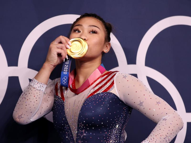 Sunisa Lee of the U.S. poses with her gold medal after winning the women's all-around final at the Tokyo Olympics on Thursday. Sunisa Lee of the U.S. poses with her gold medal after winning the women's all-around final at the Tokyo Olympics on Thursday.