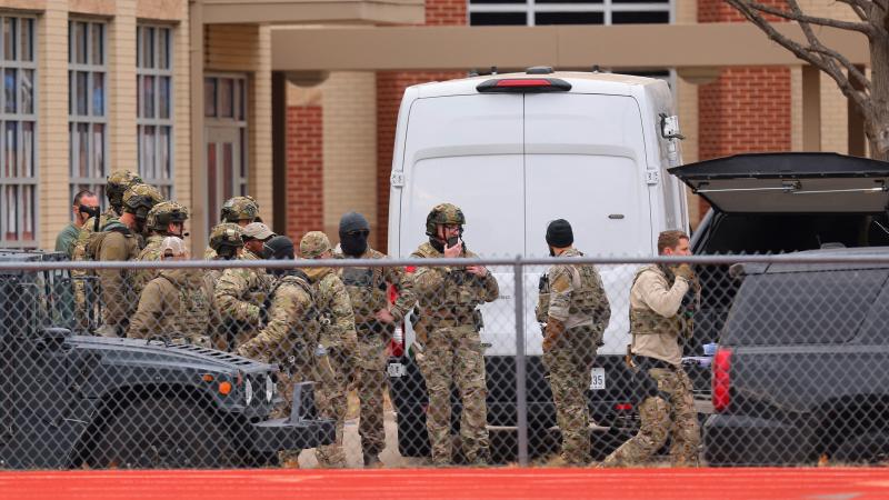 SWAT team members deploy near the Congregation Beth Israel Synagogue in Colleyville, Texas, near Dallas, on Saturday. SWAT team members deploy near the Congregation Beth Israel Synagogue in Colleyville, Texas, near Dallas, on Saturday.