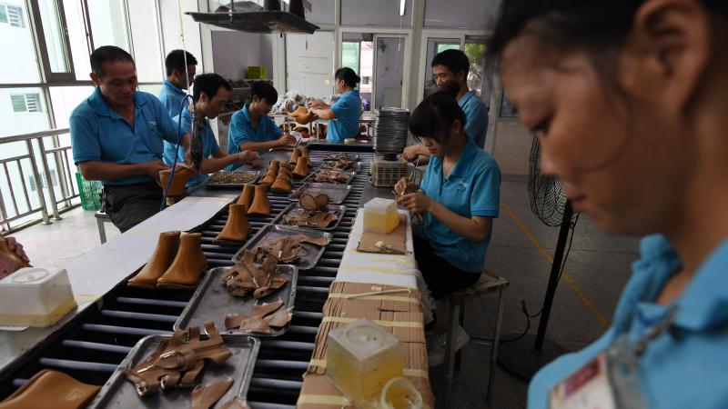 Workers assemble shoes in 2016 at a Huajian shoe factory in southern China, where about 100,000 pairs of Ivanka Trump-branded shoes have been made over the years. Workers assemble shoes in 2016 at a Huajian shoe factory in southern China, where about 100,000 pairs of Ivanka Trump-branded shoes have been made over the years.