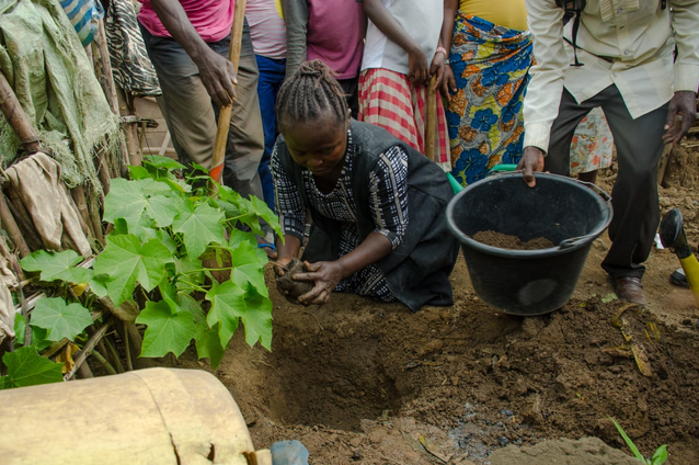 Kathungu Kinyatole plants a tree to honor a loved one she lost to the Ebola virus. Kathungu Kinyatole plants a tree to honor a loved one she lost to the Ebola virus.