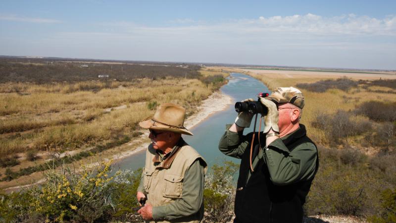 Dob Cunningham (left) and his friend Larry Johnson look over the edge of Cunningham's 800-acre ranch in Quemado, Texas. Dob Cunningham (left) and his friend Larry Johnson look over the edge of Cunningham's 800-acre ranch in Quemado, Texas.
