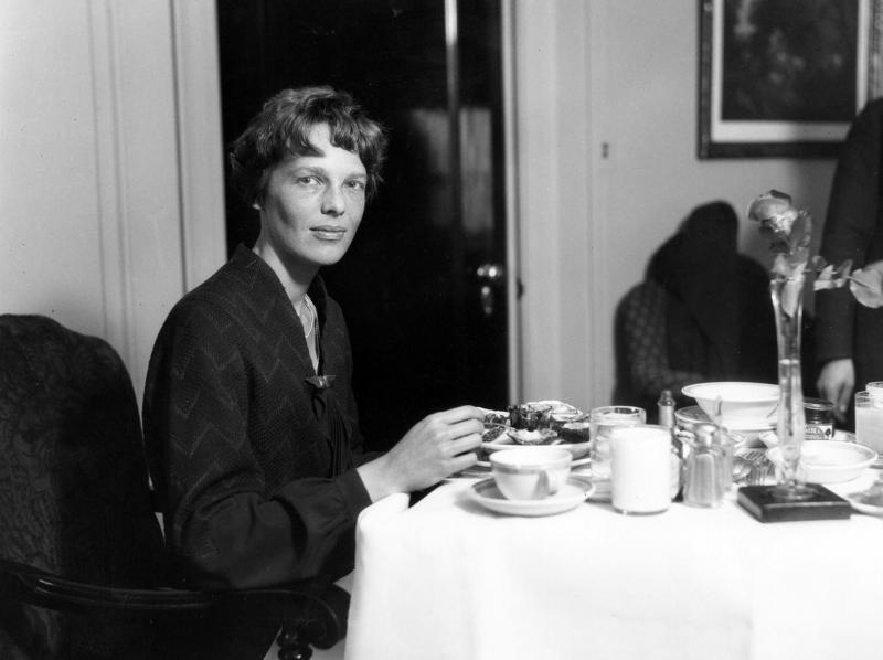 Amelia Earhart eats dinner at a Cleveland hotel. Her in-flight menu, however, was usually simple, often consisting of tomato juice and a hard-boiled egg. Amelia Earhart eats dinner at a Cleveland hotel. Her in-flight menu, however, was usually simple, often consisting of tomato juice and a hard-boiled egg.