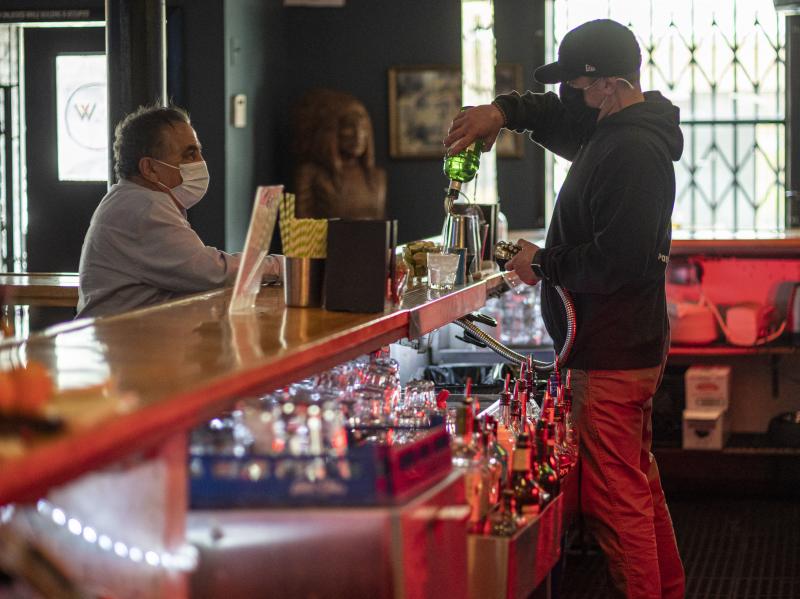 A bartender mixes a drink inside a bar last week in San Francisco. The latest retail sales data out on Friday showed an increase in sales at restaurants and bars as more people venture out amid the continued reopening of the U.S. economy. A bartender mixes a drink inside a bar last week in San Francisco. The latest retail sales data out on Friday showed an increase in sales at restaurants and bars as more people venture out amid the continued reopening of the U.S. economy.